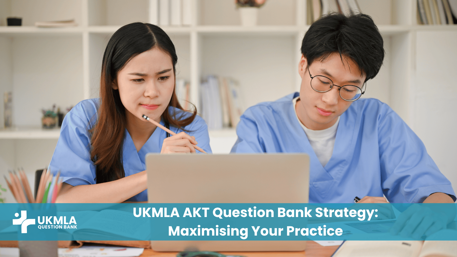 Medical students focused on their laptop, developing a strategy for their UKMLA AKT question bank practice to prepare for the exam.